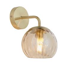 A lustrous modern fixture, the piper pendant light by tech lighting adds refined style to interior spaces. Dimple Wall Light In Brushed Brass With Champagne Glass Jrlighting Co Uk