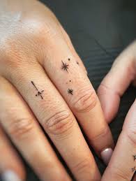 Added the cutest little finger tattoos to Katie's fingers. We put the whole star constellation (Capricorn), a cross & heart & touched up some star clusters on the other hand. Finger tattoos