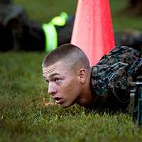 Lance Cpl. Christopher J. Belton takes aims in during