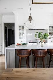 wooden stools at gray kitchen island