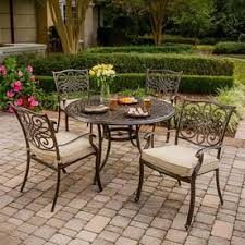 In a rainy region, resin furniture holds up well and comes in multiple designs to match any style. Hanover Traditions 5 Piece Bronze Frame Patio Set With Natural Oat Hanover Cushion S Included Lowes Com Outdoor Patio Patio Dining Furniture Patio Set