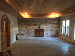 Tongue And Groove Cedar Ceiling With Reclaimed Brick Accent Wall Brick Accent Walls Accent Wall Finishing Basement Walls
