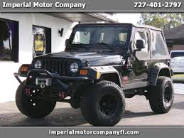 Image result for Brilliant Black 2005 Jeep