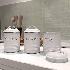 White ceramic canister with wooden lid a pair of charming canisters that will be a functional and decorative accent of your kitchen countertop. Barnyard Designs Decorative Kitchen Canisters With Lids White Metal Rustic Vintage Farmhouse Country Decor For Sugar