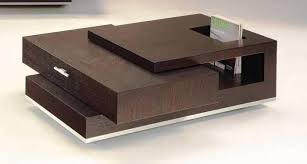 From the humble table with four legs it has now evolved into a piece of art which serves the same purpose of. 10 Modern Center Tables For The Living Room Rilane We Aspire To Inspire Center Table Living Room Living Room Table Center Table