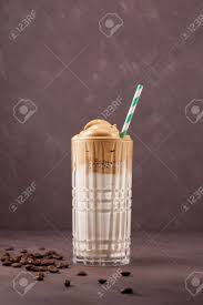For cold coffee, pour the cold milk into two glasses. Korean Drink Dalgona Coffee In Glass Cold Milk With Foam Of Instant Coffee On Brown Background Vertical Shot Stock Photo Picture And Royalty Free Image Image 148789486