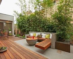 Terrassen Ideen Garten Bambuspflanzen Sichtschutz Beton Holz Sitzbank Tisch Modern Design Backyard Bamboo Garden Bamboo Plants