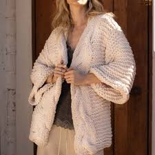 Contrasting ribbed knit accents the cuffs and hem. Sweaters Handmade Chunky Chenille Large Cable Knit Cardigan Poshmark