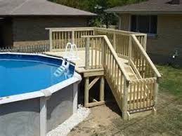 Above Ground Pool Deck Located On A 24 Above Ground Pool Features Swimming Pool Decks Small Backyard Pools Above Ground Pool Landscaping