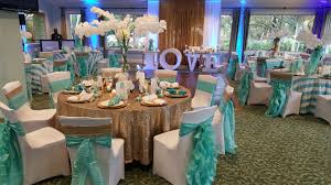 Mm with gold and teal. Turquoise White And Gold Wedding Reception With Stripes And Sequin Tablecloths Eve Gold Wedding Reception Gold Wedding Theme Gold Wedding Table Decorations