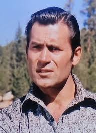 CLASSIC Clint Walker as Jim Cole in 'Night of the Grizzly'. Clint was 38 in  this photo during filming of this scene in 1965. He kept himself in superb  physical condition. Clint