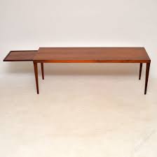 The smaller tables have black laminate tops and fold away easily to be tucked back in there compartment. Antiques Atlas Danish Rosewood Coffee Table By Sven Ellekaer
