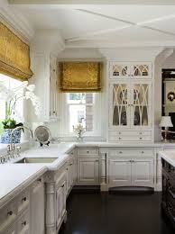 This antique white set of kitchen cabinets enchants with its traditional design, fitting perfectly well into classic interiors. Traditional Kitchen Cabinets Photos Tips For 2020