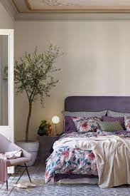 Bedroom With Floor Tiles And Colourful Floral Beding Easy Home Decor Home Decor Online Contemporary Home Decor