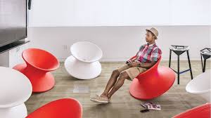 Spun chair by thomas heatherwick for magis. A Male College Student Reclines In A Red Magis Spun Chair Surrounded By Other Red And White Magis Spun Chairs Herman Miller Space Design Chair Floor Chair