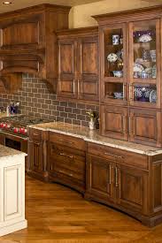 Moreover, dark hardwood added also nice touch to the kitchen remodeling ideas. White Ice Granite Countertop Brown Rustic Cabinet Hardwood Floor Backspl Dark Brown Kitchen Cabinets Kitchen Cabinets And Countertops White Granite Countertops