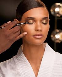 Get the look: Sweep the rich mocha hue of Eye Color Quad in 01 Golden Mink  allover lids, then apply the shimmering gold of Eye Color Quad in 26  Leopard Sun at