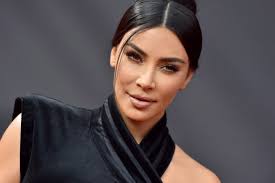 Kim Kardashian West Debuts Fiery Red Hair and Fans Don't Know How to Feel  About It