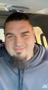 Can you edit this photo to improve smile and background?