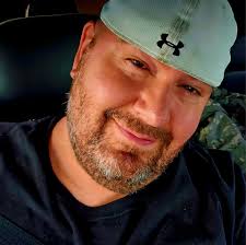 Same reason you never see Batman and Bruce Wayne in the same place.