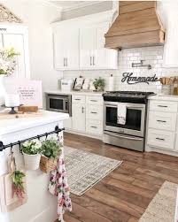 Looking for kitchen vent range hood home design photos? Farmhouse Is My Style Cute Modern Farmhouse Kitchen With Large Subway Tile Wood Style Hood Vent White Cabinets Against Medium Dark Hardwoods So Bright And Airy Love Farmhouseismystyle Farmhousekitchen