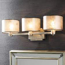From silver bells to shining gold ornaments hanging from a tree, metallics add a touch of chic to any home. Champagne Elegance Bath Light 3 Light Shades Of Light Bath Light Powder Room Lighting Bathroom Light Fixtures