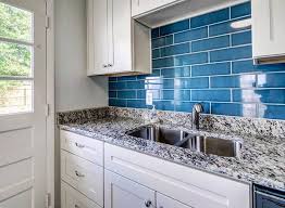At a glance, the backsplash idea seems marble or tile for flooring. White Kitchen With Blue Subway Tile Backsplash Novocom Top