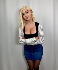 buttercupcosplays, android 18, dragon ball, dragonball z, real life,  highres, photo (medium), 1girl, android 18 (cosplay), blonde hair, breasts,  cosplay, large breasts, medium hair, miniskirt, pantyhose, short hair,  skirt, smile, solo -