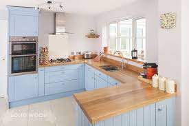 What are the advantages of wood kitchen cabinets? Olympus Digital Camera Stunning Blue Kitchen With Oak Cabinets Regarding Blue Kitchen With Oak Cab Kitchen Cabinets Uk Kitchen Design Small Solid Wood Kitchens