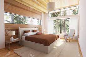 Bei xxxlutz finden sie sowohl kombinationen mit schwebetürenschränken als auch mit drehtürenschränken. Holz Schlafzimmer Interieur Mit Bett Holzstirnwande Und Grosse Fenster Mit Blick In Die Natur Lizenzfreie Fotos Bilder Und Stock Fotografie Image 36534182