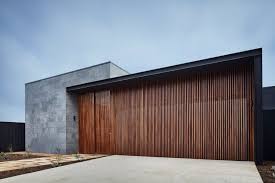 Duplex with side load garage in one unit 69392am tural. Courtyard House By Lifespaces Group The Coolector