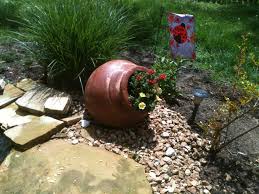 This is also an easy way since a spill pot is planted just like any flower bed. Tipped Pot With Bright Flowers Homebnc