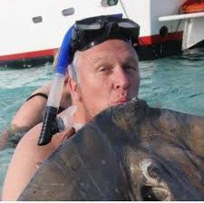 What is the least busy day and time to visit Stingray City in the Cayman  Islands?