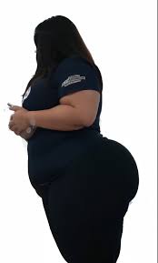 Araffe in a black shirt and grey shorts taking a selfie, thicc - SeaArt AI