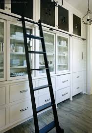 Paige Sumblin Schnell Atlanta Homes Mag Huge Open Kitchen With Rolling Black Ladder Ivory Glass Front K Kitchen Pantry Design Kitchen Ladder Pantry Design
