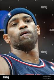 New Jersey Nets' Vince Carter runs into the defense of Cleveland Cavaliers' Donyell  Marshall, rear, during the fourth quarter of Game 6 NBA Eastern conference  semifinal basketball Friday night, May 18, 2007