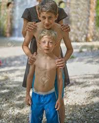 Two Brothers Boys Aged Twelve Or Thirteen And Five Or Six In Stock Photo Picture And Royalty Free Image Image 142146624