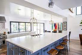Large Kitchen Island With Open Concept Floor Plan Accordion Windows White Walls And West El Trendy Kitchen Tile White Modern Kitchen Interior Design Kitchen