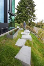 10 Ideas For Stepping Stones In Your Garden Large Concrete Stepping Stones Line The Side Of T Landscape Stepping Stones Landscape Design Garden Architecture