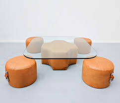 It makes the perfect perch for decorative serving trays or even board games for game nights with friends and family. Leather Glass Coffee Table 4 Stools By Guido Faleschini 1970s 158683