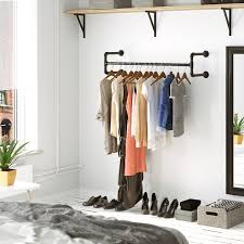 There were shelves in there that she used for hanging clothes that were just at head height and really needed to be removed to allow you to walk around the bed without banging your head. Clothes Hanging Racks Off 60