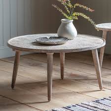 White washed/black medium round wood coffee table: Agra Patterned Wooden Coffee Table Natural White Wash Caspian House Furniture123