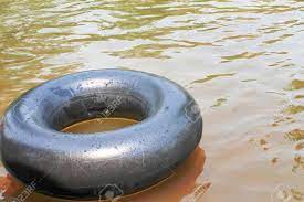 Whether your favorite water is a riffly river, a placid lake, or a local swimming hole, a float tube—also known as a belly boat—always adds to the experience. Old Inner Tubes With Water Drops And Reflection From The Sun Floating On A River Stock Photo Picture And Royalty Free Image Image 121267948