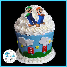 Just thinking about it makes me want to buy the old nintendo where you have to blow in the games if they froze. Mario Brothers Giant Cupcake Birthday Cake Blue Sheep Bake Shop