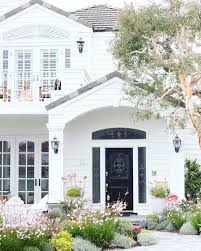 Beautiful White Traditional Home Exterior With Arched Transom Window Above Front Door Arched Windows In French Traditional Home Exteriors House Exterior House