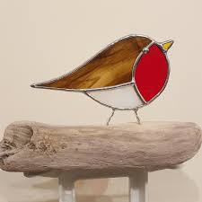 A gorgeous christmas book we love is little robin's christmas it's about a kind hearted robin who gives all of his warm and colourful vests away to friends in need. Stained Glass Robins On Driftwood The British Craft House