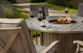 Portland Round 6 Seater Dining Set With Fire Pit 1650 Outdoor Dining Table Setting Fire Glass Garden Furniture Sets
