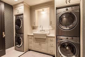 A stackable washer and dryer offers a unique way to fit a laundry appliance combo into a tight it also has three wash and rinse speed combinations and four heat selections with an air fluff setting. Contemporary Laundry Room With Two Sets Of Stacked Washers And Dryers Flanking Sink Contemporary Laundry Room