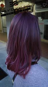 We've told you about two dark shades of purple to try—but what's one to do if they want a hair color that falls somewhere in between super deep and extremely light? Violet Hair Color