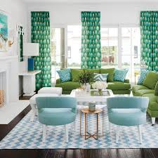 Peter Dunham Bukhara Drapes Blue And Green Living Room Features Two Green Sofas Lined With B Blue And Green Living Room Living Room Green Coastal Living Rooms